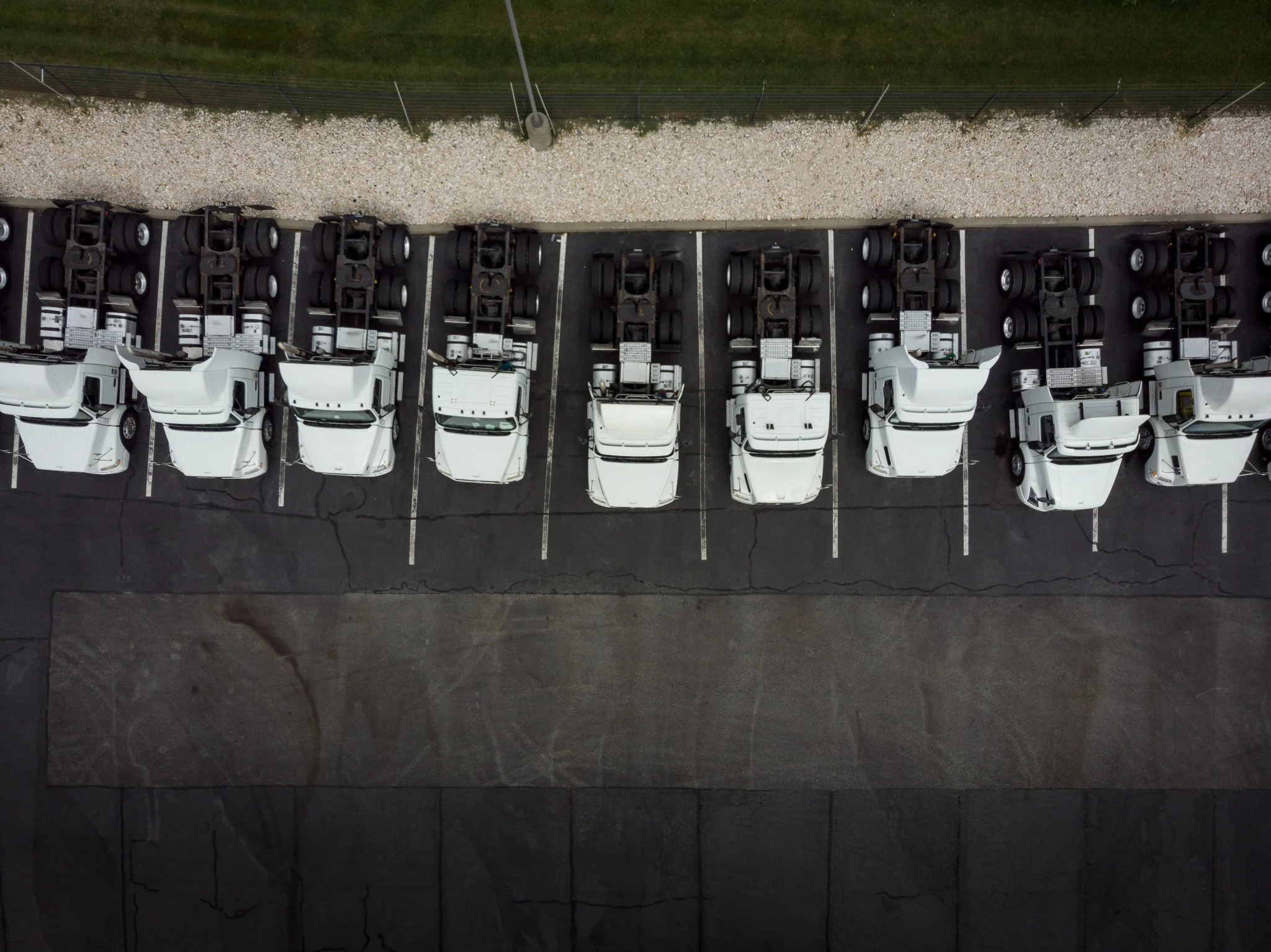 Aerial view of parked tractor units representing available carrier capacity