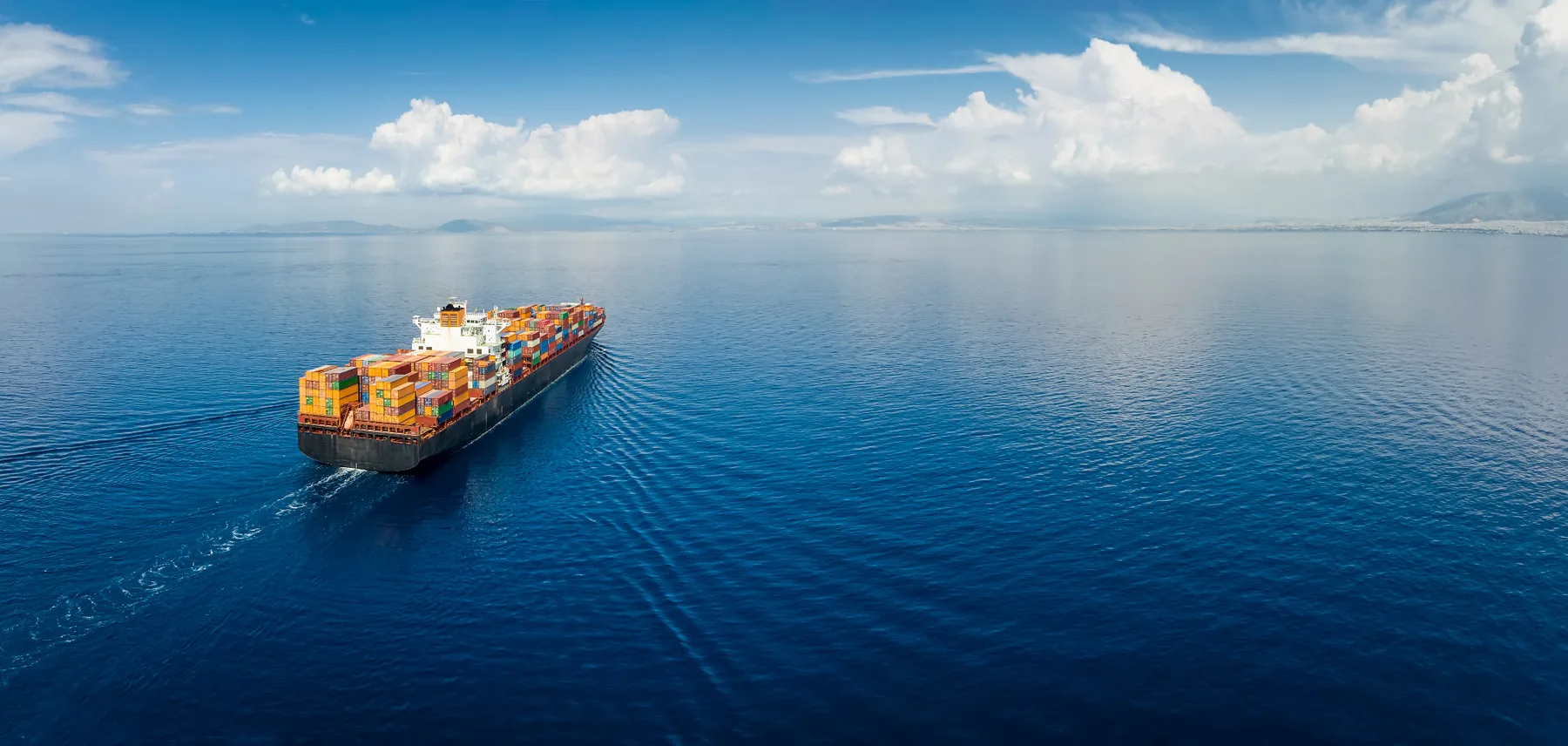 Container vessel moving through open water