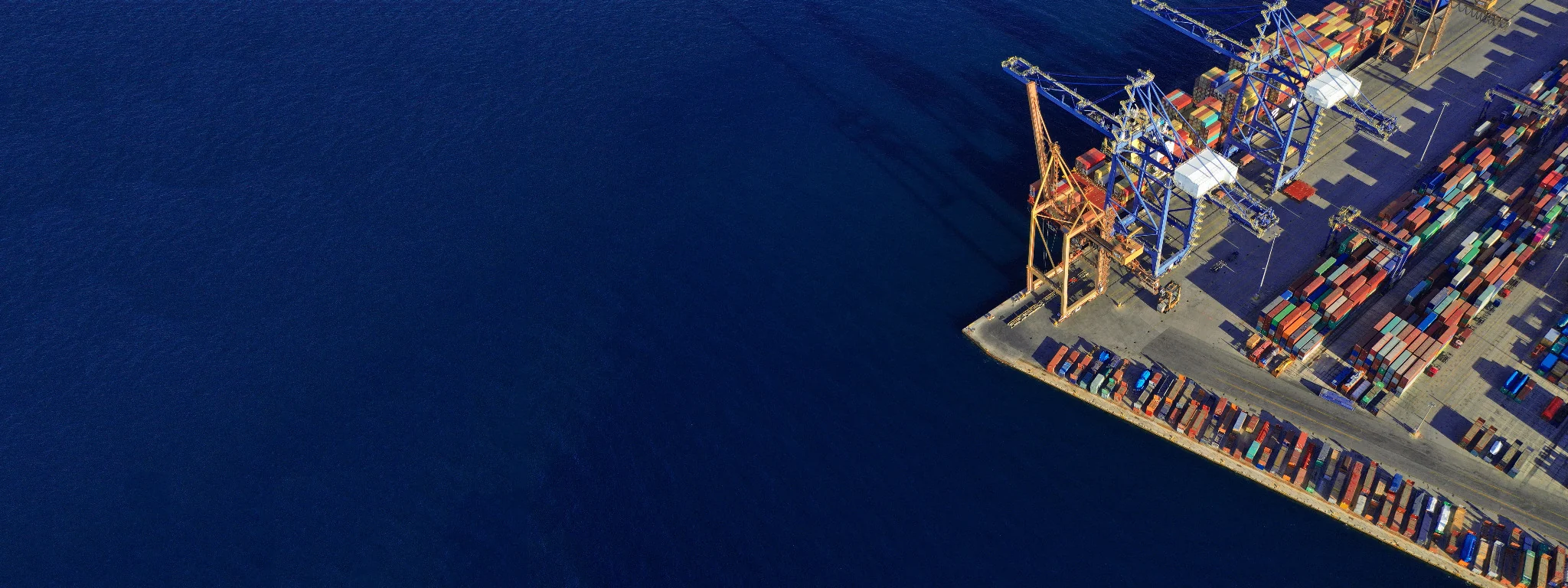 Aerial view of a marine container terminal with open water