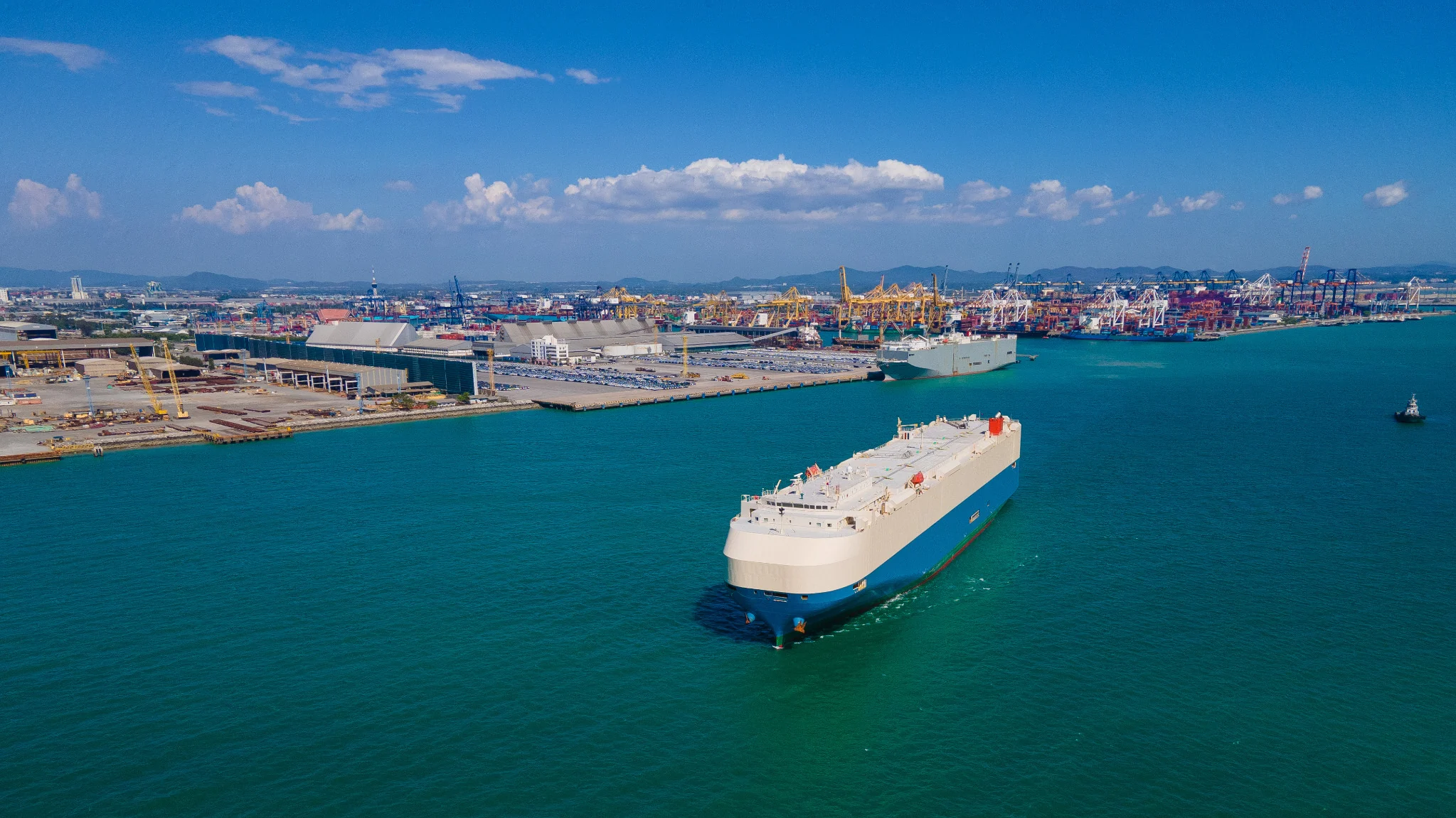 Roll-on roll-off vessel approaching a port terminal