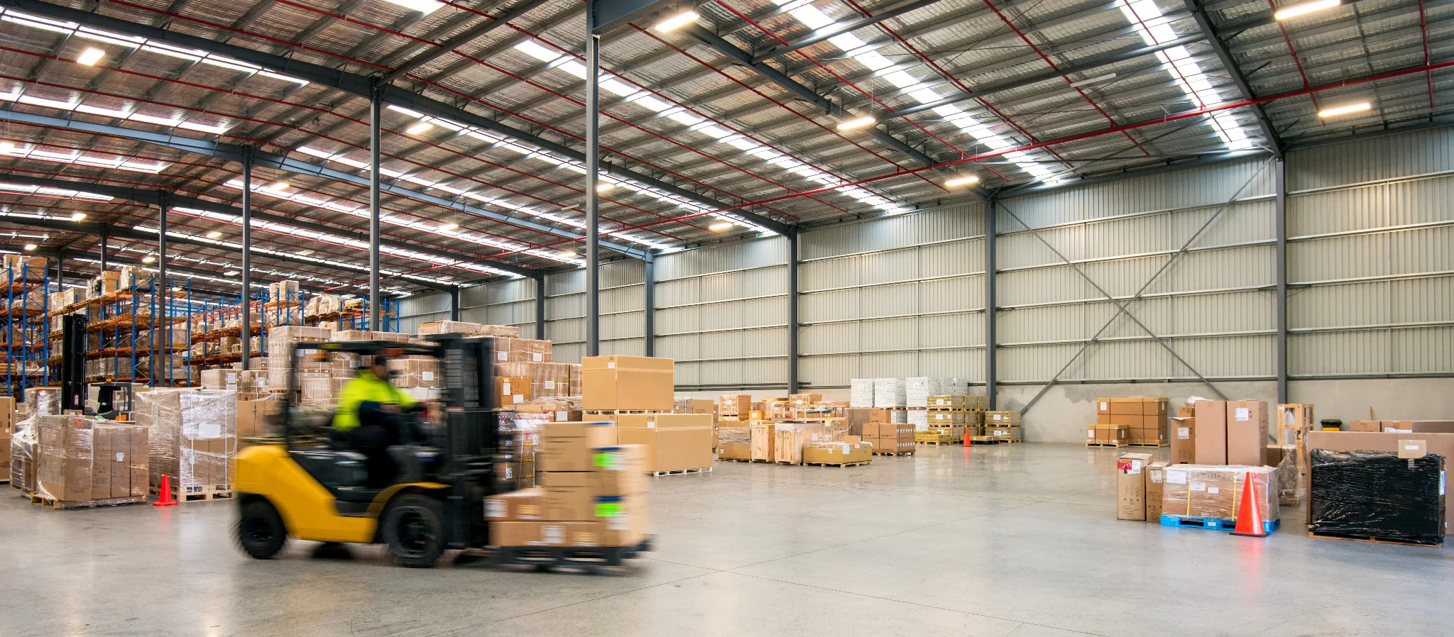 Warehouse aisle and racking supporting industrial inventory